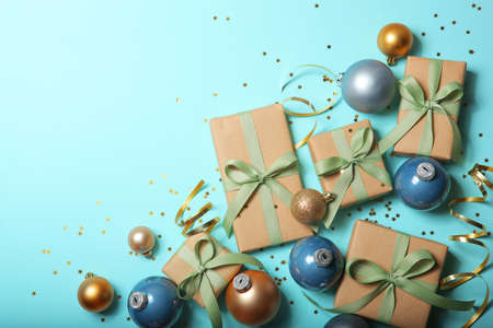 Christmas decorations and gifts on a colored background top viewの写真素材