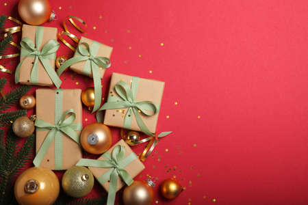 Christmas decorations and gifts on a colored background top viewの写真素材