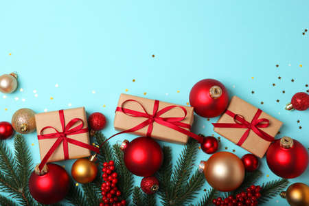 Christmas decorations and gifts on a colored background top viewの写真素材