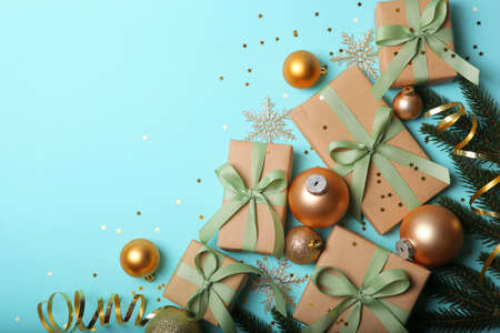 Christmas decorations and gifts on a colored background top viewの写真素材