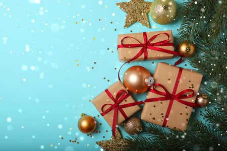 Christmas decorations and gifts on a colored background top viewの写真素材