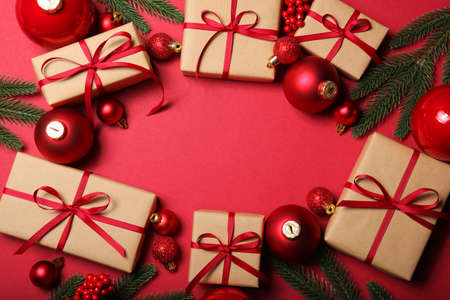 Christmas decorations and gifts on a colored background top viewの写真素材