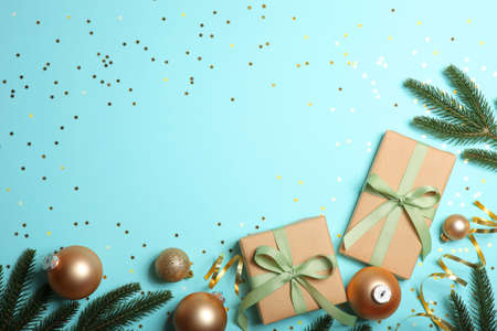 Christmas decorations and gifts on a colored background top viewの写真素材