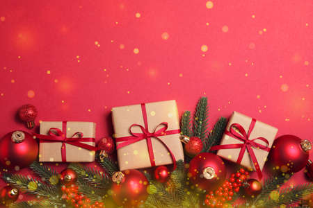 Christmas decorations and gifts on a colored background top viewの写真素材
