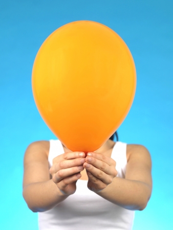 Young Woman Holding a Balloonの写真素材