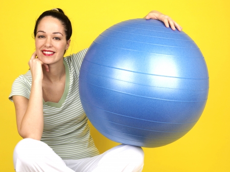 Young Woman Using Swiss Ball. Model Releasedの写真素材