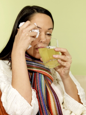 Sick Woman Drinking Soluble Medicineの写真素材