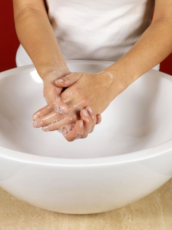 Young Woman Washing Handsの写真素材