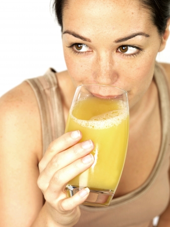Young Woman Drinking Fruit Juiceの写真素材