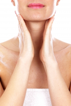 Young Woman Applying Body Creamの写真素材