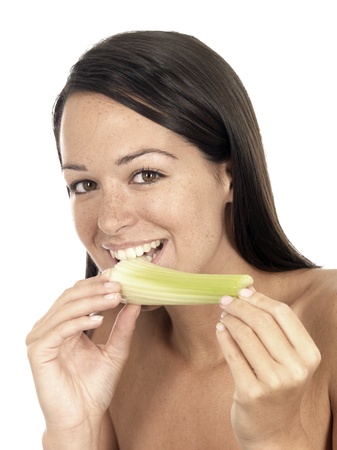 Young Woman Eating Celeryの写真素材