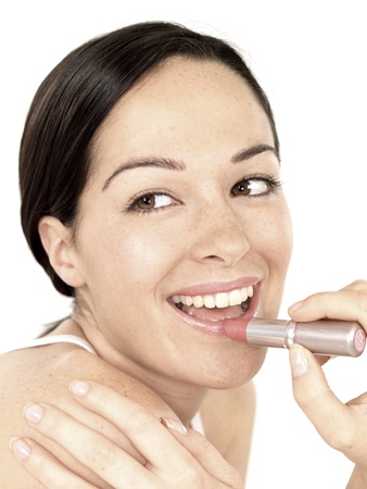 Young Woman Applying Lipstickの写真素材