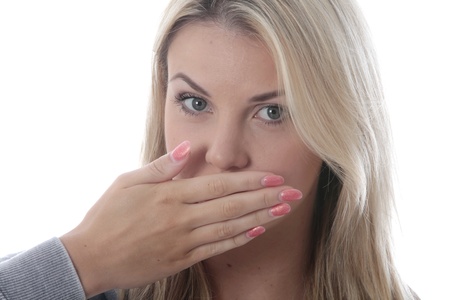Model Released.  Young Woman Covering Her Mouthの写真素材