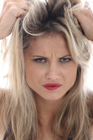 Model Released. Angry Young Woman Pulling Her Hairの写真素材