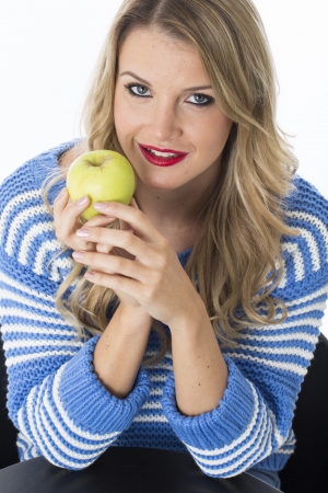Model Released. Attractive Young Woman Holding an Appleの写真素材