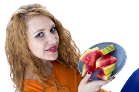 Model Released. Happy Young Woman Eating Water Melonの写真素材