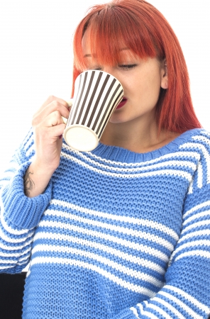 Model Released. Attractive Young Woman Drinking Coffeeの写真素材