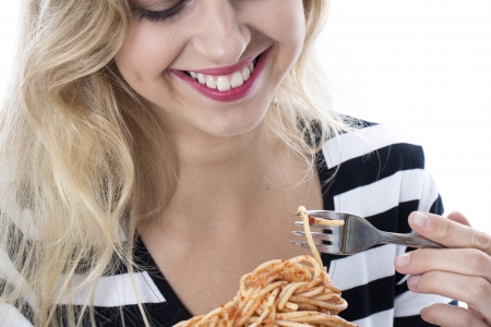 Attractive Young Woman Eating Spaghettiの写真素材