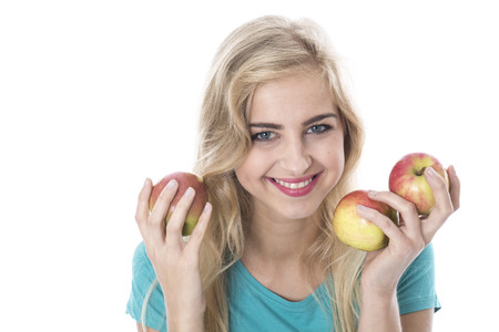 Attractive Young Woman Holding Applesの写真素材