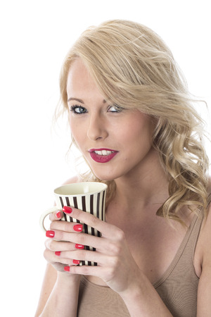 Model Released. Attractive Young Woman Drinking Coffeeの写真素材