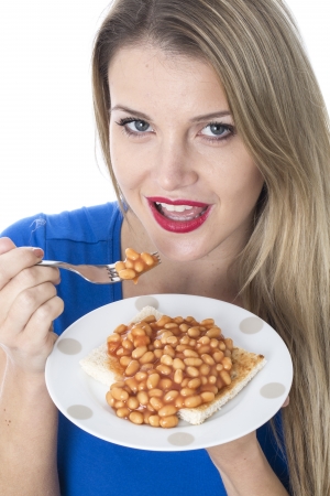  Attractive Young Woman Eating Baked Beans on Toastの写真素材