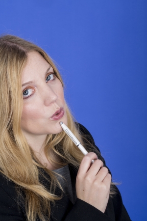 Model Released. Attractive Young Business Woman Holding a Penの写真素材