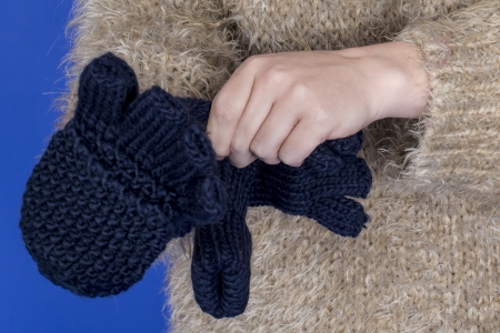 Model Released. Attractive Young Woman Putting on Glovesの写真素材