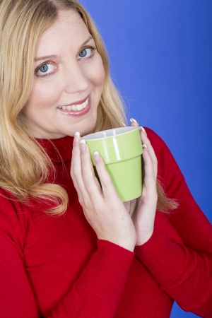Model Released. Attractive Young Woman Holding Cup Coffeeの写真素材