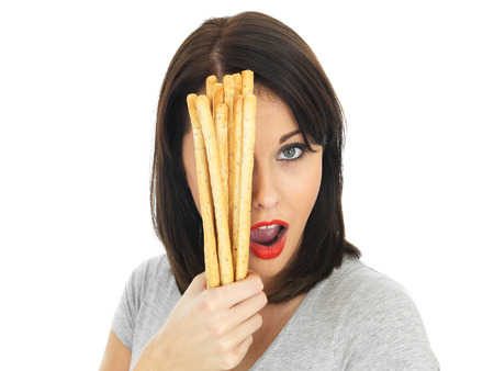 Attractive Young Woman Holding Bread Sticksの写真素材