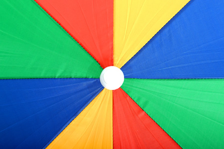 Colourful Large Open Beach Umbrella Yellow Red and Greenの写真素材