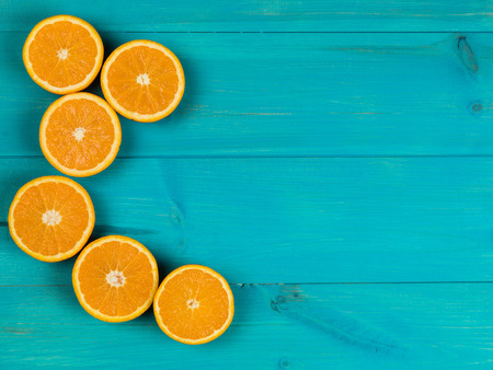 Fresh Ripe Natural Healthy Oranges On A Blue Backgroundの写真素材