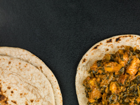 Indian Vegetarian Saag Paneer With Chipattis Flat Breadの写真素材
