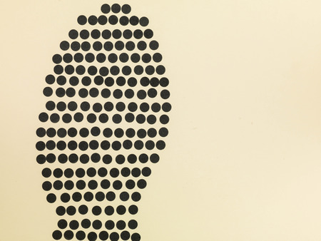 Coloured Spots in the Shape of the Sole of a Shoe Using Black Colored Spotsの写真素材