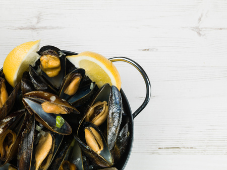 Rope Grown Mussels in a Garlic and Shallot Sauce With Slices of Lemonの写真素材