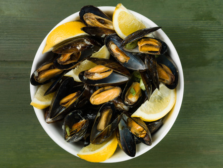 Rope Grown Mussels in a Garlic and Shallot Sauce With Slices of Lemonの写真素材