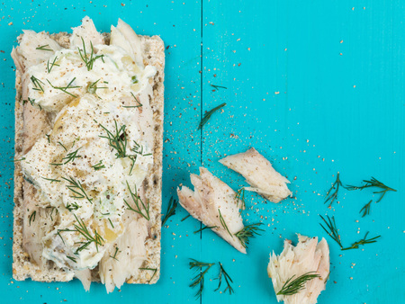 Smoked Mackerel and Potato Salad on Rye Crispbreadの写真素材