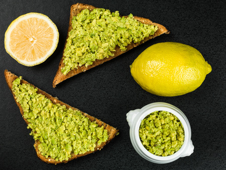 Fresh Avocado on Toasted Bread Against a Black Background