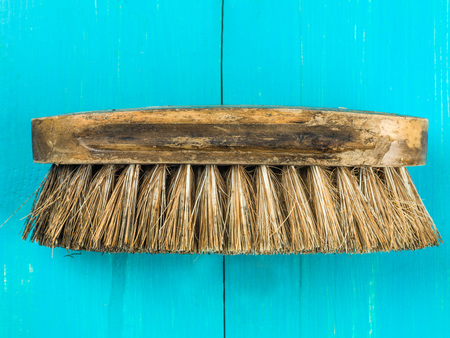 Image of a Natural Bristle Scrubbing Brush Against a Blue Backgroundの写真素材
