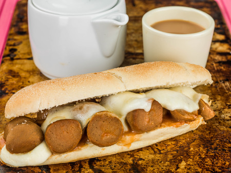 Mozzarella Cheese and Meatball Bread Roll On a Distressed Used Oven Trayの写真素材