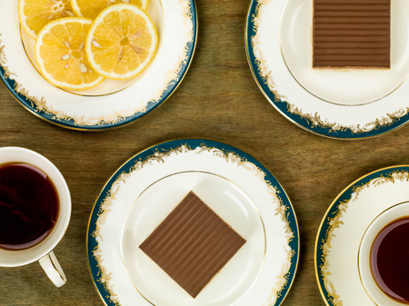 Millionaire's Shortbread With Lemon Tea Against A Brown Wooden Backgroundの写真素材