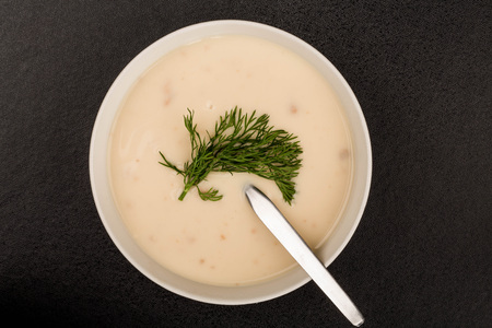 Bowl of Homemade Chicken Soup Against A Black Backgroundの写真素材