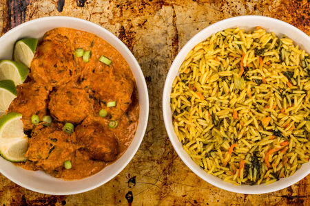 Indian Style Vegetable Kofta Curry Meal On A Distressed Oven Baking Tray With Pillau Riceの写真素材