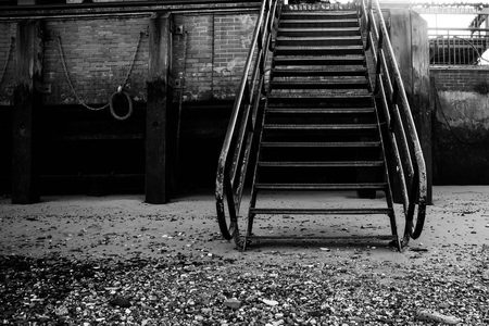 Iron or Steel Steps Leading from a Beach To A Walkwayの写真素材