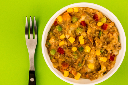 Traditional Shepherd's Pie And Vegetables Served In A Bowl With Sweet Corn And Red Peppers