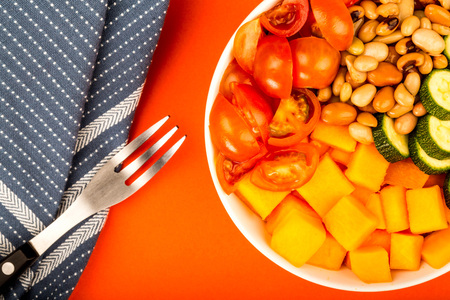 Healthy Vegan Or Vegetarian Sweet Potato And Beans Hawaiian Stlye Buddha Bowl Against A Red Backgroundの写真素材