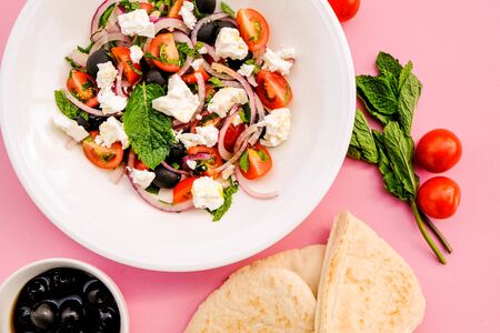 Greek Style Mediterranean Feta Cheese and Fresh Salad With Tomatoes and Black Olivesの写真素材