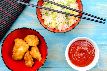 Chinese Style Sweet and Sour Fried Chicken With Egg Fried Rice and Vegetablesの写真素材