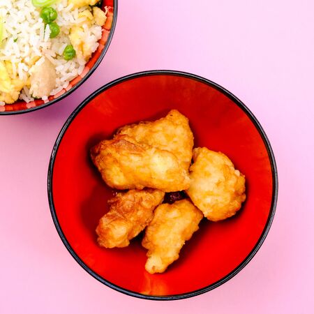 Chinese Style Sweet and Sour Fried Chicken With Egg Fried Rice and Vegetablesの写真素材