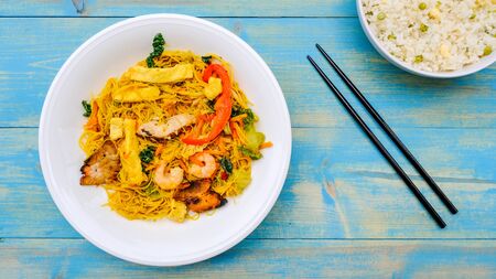 Healthy Meal of Singapore Noodles With Egg Fried Riceの写真素材