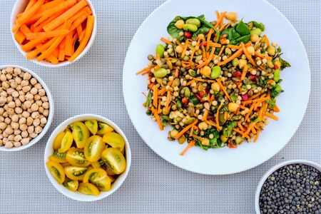 Vegetarian Summer Salad with Couscous and Edamame Beans, Green Lentils, Carrots and Herbsの写真素材